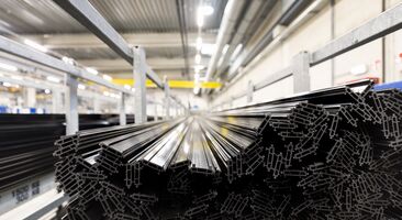 Synthetic thermal strips stacked in iron chassis in warehouse.