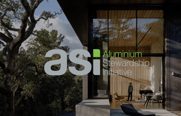 ASI logo in front of modern villa in a forest.